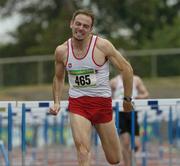 24 July 2005; Peter Coughlan, Crusaders A.C., crosses the line to win the Men's 110m hurdles during the AAI National Track and Field Championships. Morton Stadium, Santry, Dublin. Picture credit; Pat Murphy / SPORTSFILE