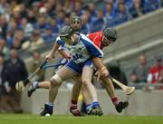 24 July 2005; Fergal Hartley, Waterford, is tackled by Brian Corcoran, Cork. Guinness All-Ireland Senior Hurling Championship Quarter-Final, Cork v Waterford, Croke Park, Dublin. Picture credit; Ray McManus / SPORTSFILE