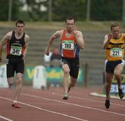 24 July 2005; Gary Ryan, Nenagh Olympic A.C., centre, in action against David Hynes, Menapians A.C., left, and Darren O'Donovan, Leevale A.C., right, on his way to victory in the Men's 100m final during the AAI National Track and Field Championships. Morton Stadium, Santry, Dublin. Picture credit; Pat Murphy / SPORTSFILE