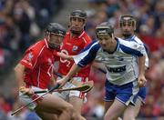 24 July 2005; Fergal Hartley, Waterford, prepares to clear under pressure from Cork's Brian Corcoran. Guinness All-Ireland Senior Hurling Championship Quarter-Final, Cork v Waterford, Croke Park, Dublin. Picture credit; Ray McManus / SPORTSFILE
