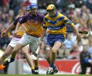 24 July 2005; Tony Griffin, Clare, is tackled by Diarmuid Lyng, Wexford. Guinness All-Ireland Senior Hurling Championship Quarter-Final, Wexford v Clare, Croke Park, Dublin. Picture credit; Brendan Moran / SPORTSFILE