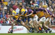 24 July 2005; Brian O'Connell, Clare, supported by team-mate Diarmuid McMahon, in action against Declan Ruth, Paul Carley and Rory McCarthy, Wexford. Guinness All-Ireland Senior Hurling Championship Quarter-Final, Wexford v Clare, Croke Park, Dublin. Picture credit; Brendan Moran / SPORTSFILE