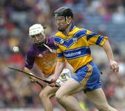 24 July 2005; Niall Gilligan, Clare, in action against Redmond Barry, Wexford. Guinness All-Ireland Senior Hurling Championship Quarter-Final, Wexford v Clare, Croke Park, Dublin. Picture credit; Brendan Moran / SPORTSFILE