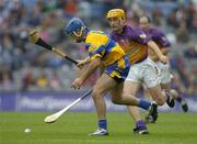24 July 2005; Alan Markham, Clare, in action against Rory McCarthy, Wexford. Guinness All-Ireland Senior Hurling Championship Quarter-Final, Wexford v Clare, Croke Park, Dublin. Picture credit; Brendan Moran / SPORTSFILE