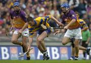 24 July 2005; Diarmuid McMahon, Clare, in action against David O'Connor, left, and Diarmuid Lyng, Wexford. Guinness All-Ireland Senior Hurling Championship Quarter-Final, Wexford v Clare, Croke Park, Dublin. Picture credit; Brendan Moran / SPORTSFILE