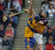 24 July 2005; Gerry O'Grady, Clare, in action against Rory Jacob, Wexford. Guinness All-Ireland Senior Hurling Championship Quarter-Final, Wexford v Clare, Croke Park, Dublin. Picture credit; Ray McManus / SPORTSFILE