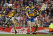 24 July 2005; Niall Gilligan, Clare, in action against Redmond Barry, left, and Darragh Ryan, Wexford. Guinness All-Ireland Senior Hurling Championship Quarter-Final, Wexford v Clare, Croke Park, Dublin. Picture credit; Ray McManus / SPORTSFILE