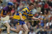 24 July 2005; Diarmuid McMahon, Clare, in action against Diarmuid Lyng, Wexford. Guinness All-Ireland Senior Hurling Championship Quarter-Final, Wexford v Clare, Croke Park, Dublin. Picture credit; Ray McManus / SPORTSFILE