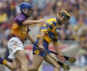 24 July 2005; Tony Griffin, Clare, in action against Diarmuid Lyng, Wexford. Guinness All-Ireland Senior Hurling Championship Quarter-Final, Wexford v Clare, Croke Park, Dublin. Picture credit; Damien Eagers / SPORTSFILE