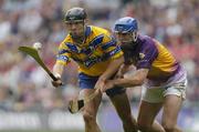 24 July 2005; Tony Carmody, Clare, in action against David O'Connor, Wexford. Guinness All-Ireland Senior Hurling Championship Quarter-Final, Wexford v Clare, Croke Park, Dublin. Picture credit; Damien Eagers / SPORTSFILE