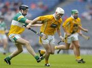 23 July 2005; Johnny McIntosh, Antrim, in action against Kevin Brady, Offaly. Guinness All-Ireland Senior Hurling Championship, Relegation Section, Semi-Final, Offaly v Antrim, Croke Park, Dublin. Picture credit; Brendan Moran / SPORTSFILE