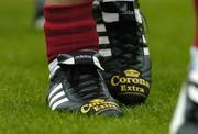 24 July 2005; The boots of Cork hurler Niall McCarthy displaying an advertisement for an alcoholic beverage during the pre-match parade. Guinness All-Ireland Senior Hurling Championship Quarter-Final, Cork v Waterford, Croke Park, Dublin. Picture credit; Brendan Moran / SPORTSFILE
