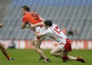 23 July 2005; Paul McGrane, Armagh, is tackled by Enda McGinley, Tyrone. Bank of Ireland Ulster Senior Football Championship Final Replay, Tyrone v Armagh, Croke Park, Dublin. Picture credit; Brendan Moran / SPORTSFILE
