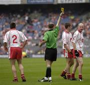 23 July 2005; Ryan McMenamin (2), Tyrone, is shown a yellow card by referee Michael Collins. Bank of Ireland Ulster Senior Football Championship Final Replay, Tyrone v Armagh, Croke Park, Dublin. Picture credit; Brendan Moran / SPORTSFILE