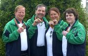 25 July 2005; Connacht athletes from left to right, John Cormican, from Dysart, Co. Roscommon, winner of a bronze medal, Tom Devereux, from Nelae, Co. Mayo, Monica Finn from Roscommon town, who won two bronze medals and Bridie Nicholson, from Sligo at the World Transplant Games pictured on their arrival at Dublin Airport. Irish World Transplant Games team homecoming, Dublin Airport, Dublin. Picture credit; Damien Eagers / SPORTSFILE