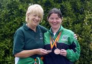 25 July 2005; Vera Frisby, left, Chairman of the Irish Kidney Association with Emma Walsh, from Ballyragget, Co. Kilkenny winner of 2 bronze medals at World Transplant Games pictured on their arrival at Dublin Airport. Irish World Transplant Games team homecoming, Dublin Airport, Dublin. Picture credit; Damien Eagers / SPORTSFILE