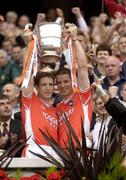 23 July 2005; Armagh captain Kieran McGeeney, left, and team-mate Paul McGrane lifts the Anglo Celt cup after the game. Bank of Ireland Ulster Senior Football Championship Final Replay, Tyrone v Armagh, Croke Park, Dublin. Picture credit; Brendan Moran / SPORTSFILE