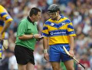 24 July 2005; Referee Brian Gavin takes Tony Carmody's, Clare, name during the match. Guinness All-Ireland Senior Hurling Championship Quarter-Final, Wexford v Clare, Croke Park, Dublin. Picture credit; Ray McManus / SPORTSFILE