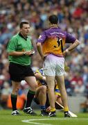 24 July 2005; Referee Brian Gavin talks to Wexford's Darragh Ryan and Clare's Tony Carmody during the match. Guinness All-Ireland Senior Hurling Championship Quarter-Final, Wexford v Clare, Croke Park, Dublin. Picture credit; Ray McManus / SPORTSFILE