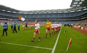23 July 2005; The Tyrone and Armagh teams, led by respective captains Brian Dooher and Kieran McGeeney, march in the pre-match parade before the game in front of an attendance of just over 31,000. Bank of Ireland Ulster Senior Football Championship Final Replay, Tyrone v Armagh, Croke Park, Dublin. Picture credit; Brendan Moran / SPORTSFILE