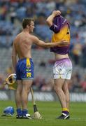 24 July 2005; Declan O'Rourke, Clare, prepares to swap jerseys with Wexford's David O'Connor. Guinness All-Ireland Senior Hurling Championship Quarter-Final, Wexford v Clare, Croke Park, Dublin. Picture credit; Ray McManus / SPORTSFILE