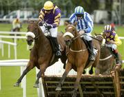 25 July 2005; Kinger Rocks, with Ruby Walsh up, right, jumps the last alongside Rajayla, Davy Condon up, on their way to winning the G.P.T. Sligo Novice Hurdle. Galway Races, Ballybrit, Co. Galway. Picture credit; Pat Murphy / SPORTSFILE