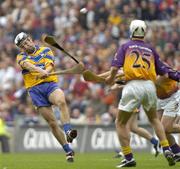 24 July 2005; Gerry Quinn, Clare, in action against Redmond Barry, (25), Wexford. Guinness All-Ireland Senior Hurling Championship Quarter-Final, Wexford v Clare, Croke Park, Dublin. Picture credit; Damien Eagers / SPORTSFILE