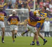 24 July 2005; Diarmuid McMahon, Clare, is tackled by Rory McCarthy, Wexford. Guinness All-Ireland Senior Hurling Championship Quarter-Final, Wexford v Clare, Croke Park, Dublin. Picture credit; Damien Eagers / SPORTSFILE