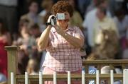 26 July 2005; A race fan records proceedings on the McDonogh Property Steeplechase. Galway Races, Ballybrit, Co. Galway. Picture credit; Pat Murphy / SPORTSFILE