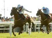 26 July 2005; Jockey Robbie Burke, onboard Latino Magic, celebrates as he races clear of the field to win the McDonogh European Breaders Fund Handicap. Galway Races, Ballybrit, Co. Galway. Picture credit; Pat Murphy / SPORTSFILE