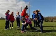 26 February 2014; Leinster and Ireland player Sophie Spence and Leinster Rugby Women's Development Officer Jennie Bognell instruct the players during the Dublin Girls Give It a Try Blitz. Templeogue United / St. Judes GAA Grounds, Dublin. Picture credit: Matt Browne / SPORTSFILE