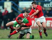 31 March 2000; Geordan Murphy, Ireland A, is tackled by Delme Williams and Paul John, right, Wales A. Six Nations &quot;A&quot; Rugby International, Ireland A v Wales A, Donnybrook, Dublin. Picture credit: Matt Browne / SPORTSFILE