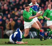 4 March 2000; Rob Henderson, Ireland, is tackled by Juan Francesio, Italy. Six Nations Rugby International, Ireland v Italy, Lansdowne Road, Dublin. Picture credit: Brendan Moran / SPORTSFILE