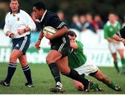18 November 2000; Sione Kepu, New Zealand A, is tackled by Pat McCarthy, Ireland A. U21 Rugby International, Ireland U21 v New Zealand U21, Dr Hickey Park, Greystones, Co. Wicklow. Picture credit: Brendan Moran / SPORTSFILE