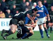 2 December 2000; Denis Hickie, St Mary's College, is tackled by Kieran Gallagher, Mike Mullins, 13, and Mike Fitzgerald, Young Munster. AIB League Rugby, St Mary's College v Young Munster, Templeville Road, Dublin. Picture credit: Brendan Moran / SPORTSFILE