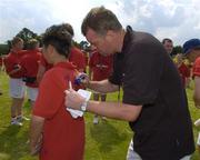 12 July 2005; Former Manchester United player Gary Pallister signs autographs at the Kidz 4 Sports Summer Campz 2005, which includes soccer, hockey and golf. Naas Sports Centre, Naas, Co. Kildare. Picture credit; Pat Murphy / SPORTSFILE