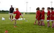 12 July 2005; Former Manchester United player Gary Pallister with young players at the Kidz 4 Sports Summer Campz 2005, which includes soccer, hockey and golf. Naas Sports Centre, Naas, Co. Kildare. Picture credit; Pat Murphy / SPORTSFILE