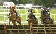 27 July 2005; Eventual winner Young Elodie, with Tom Ryan up, left, clears the last ahead of Ease The Way, with Barry Geraghty, centre, and King of Foxrock, Paul Carberry, during the HP Technology Solution & Support Hurdle. Galway Races, Ballybrit, Co. Galway. Picture credit; Pat Murphy / SPORTSFILE
