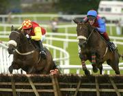 27 July 2005; Eventual winner P'tit Fute, with Kevin Coleman up, jumps the last alongside Dow Jones, left, with Tony McCoy up, on their way to winning the HP Web Governance Service Handicap Hurdle . Galway Races, Ballybrit, Co. Galway. Picture credit; Pat Murphy / SPORTSFILE