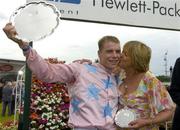 27 July 2005; Winning jockey Denis O'Regan is congratulated by owner Kay Devlin after Ansar won the Hewlett-Packard Galway Plate. Galway Races, Ballybrit, Co. Galway. Picture credit; Pat Murphy / SPORTSFILE