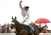 27 July 2005; Jockey Denis O'Regan celebrates as he crosses the line aboard Ansar to win the Hewlett-Packard Galway Plate. Galway Races, Ballybrit, Co. Galway. Picture credit; Pat Murphy / SPORTSFILE