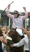 27 July 2005; Jockey Denis O'Regan celebrates after Ansar won the Hewlett-Packard Galway Plate. Galway Races, Ballybrit, Co. Galway. Picture credit; Pat Murphy / SPORTSFILE