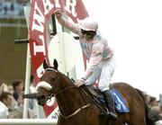 27 July 2005; Jockey Denis O'Regan celebrates as he crosses the line aboard Ansar to win the Hewlett-Packard Galway Plate. Galway Races, Ballybrit, Co. Galway. Picture credit; Pat Murphy / SPORTSFILE