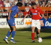 27 July 2005; Ollie Cahill, Shelbourne, in action against George Ogararu, Steuea Bucharest. UEFA Champions League, Second Qualifying Round, First Leg, Shelbourne FC v FC Steuea Bucharest, Tolka Park, Dublin. Picture credit; Brian Lawless / SPORTSFILE