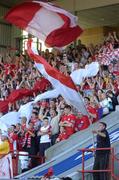 27 July 2005; Shelbourne fans wave flags at the start of the match. UEFA Champions League, Second Qualifying Round, First Leg, Shelbourne FC v FC Steuea Bucharest, Tolka Park, Dublin. Picture credit; Brian Lawless / SPORTSFILE