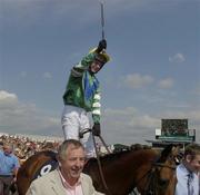 28 July 2005; Jockey Niall Madden celebrates after More Rainbows won the Guinness Galway Hurdle Handicap. Galway Races, Ballybrit, Co. Galway. Picture credit; Pat Murphy / SPORTSFILE