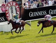 28 July 2005; More Rainbows, with Niall Madden up, crosses the line to win the Guinness Galway Hurdle Handicap ahead of Tiger Cry, with Paul Carberry up, right. Galway Races, Ballybrit, Co. Galway. Picture credit; Pat Murphy / SPORTSFILE