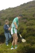 30 July 2005; Niall Quinn representing Dublin helps his son Michael along a path during the M. Donnelly Poc Fada na hEireann Final. Annaverna Mountain Ravensdale, Cooley Mountains, Co. Louth. Picture credit; Damien Eagers / SPORTSFILE