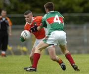 30 July 2005; Kevin O'Rourke, Armagh, is tackled by Dara Conway, Mayo. All-Ireland Minor Football Quarter-Final, Mayo v Armagh, Dr. Hyde Park, Roscommon. Picture credit; Matt Browne / SPORTSFILE