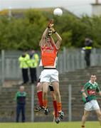 30 July 2005; David McKenna, Armagh, contests a high ball with Peter Collins, Mayo. All-Ireland Minor Football Quarter-Final, Mayo v Armagh, Dr. Hyde Park, Roscommon. Picture credit; Matt Browne / SPORTSFILE
